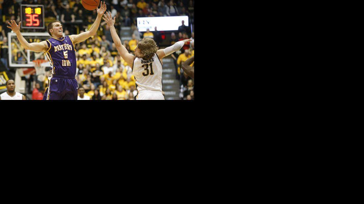 
Northern Iowa’s Nate Buchheit and Wichita State’s Ron Baker jump for a loose ball last season at Koch Arena. 
