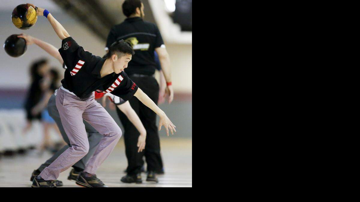 
San Jose State bowler Michael Tang warms up before the third round of the Intercollegiate Singles Championship on Tuesday at Northrock Lanes. He advanced to Saturday’s semifinals.
