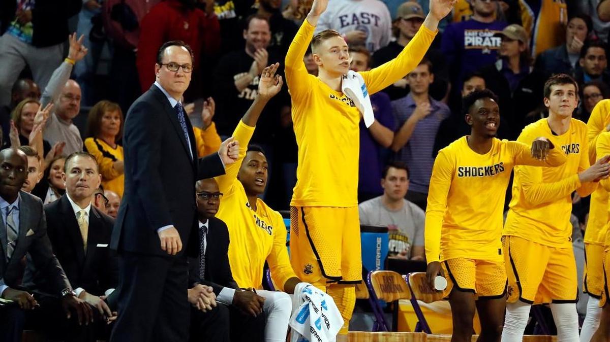 Wichita State coach Gregg Marshall watches from the sideline while the bench celebrates during Thursday’s game against East Carolina in Greenville, N.C.