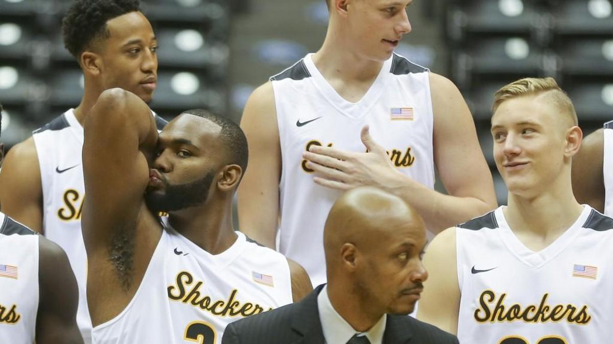 Wichita State’s Shaq Morris, left, clowns around while waiting for the team picture to taken during the team’s media day at Koch Arena on Thursday. Teammate Rauno Nurger watches.