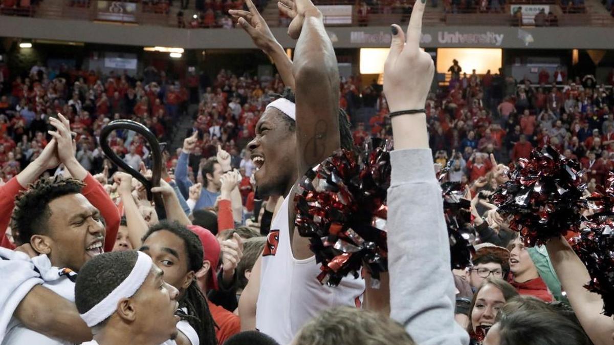 Illinois State guard Paris Lee, center, celebrates on the court with teammates and fans after Illinois State defeated Wichita State 58-53 Saturday night in Normal, Ill.