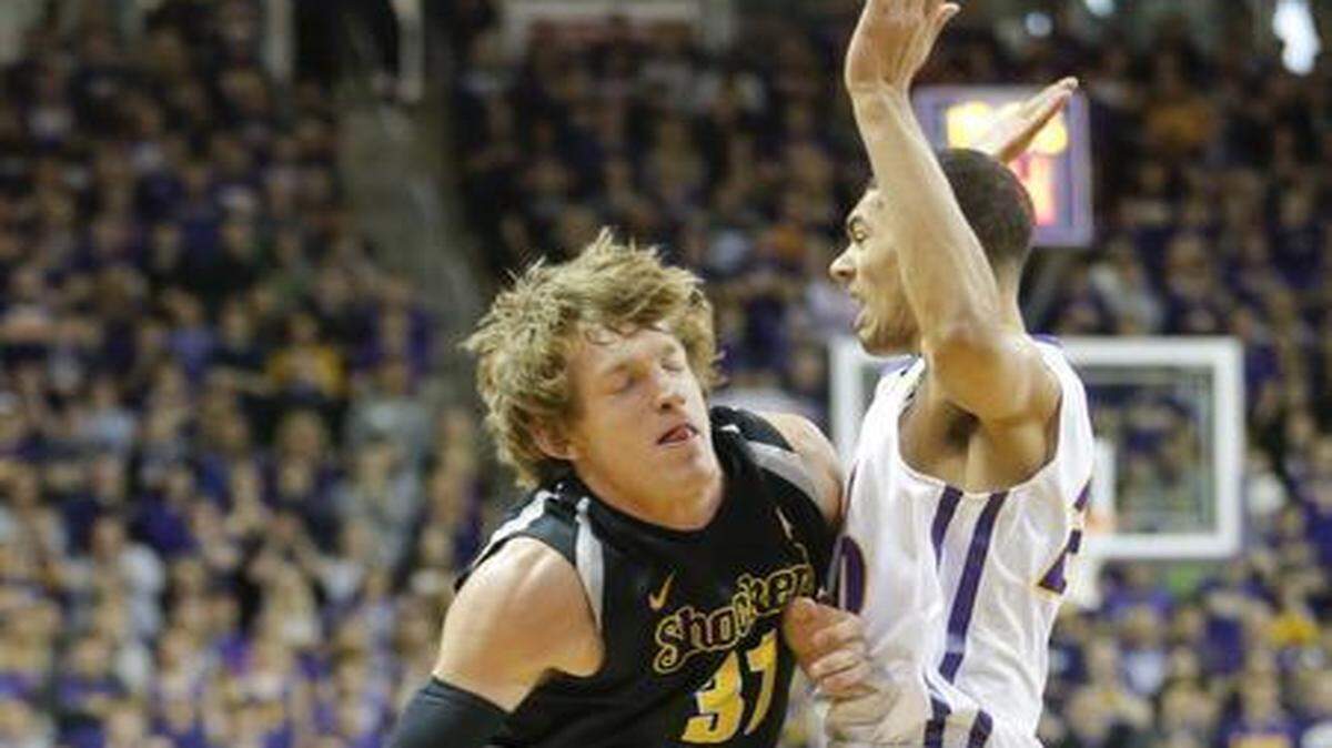 
Wichita State guard Ron Baker draws a foul from Northern Iowa guard Jeremy Morgan during the first half Saturday at the McLeod Center in Cedar Falls, Iowa.
