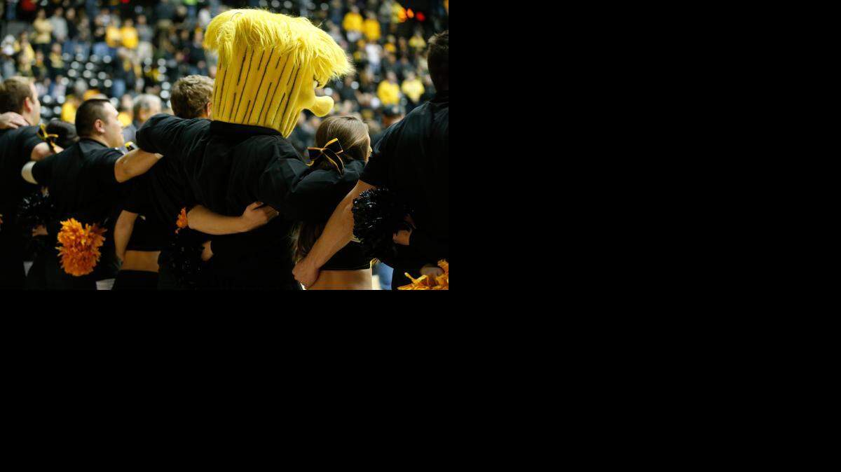 
The Wichita State University cheerleaders stand together before a game at Koch Arena in 2014.
