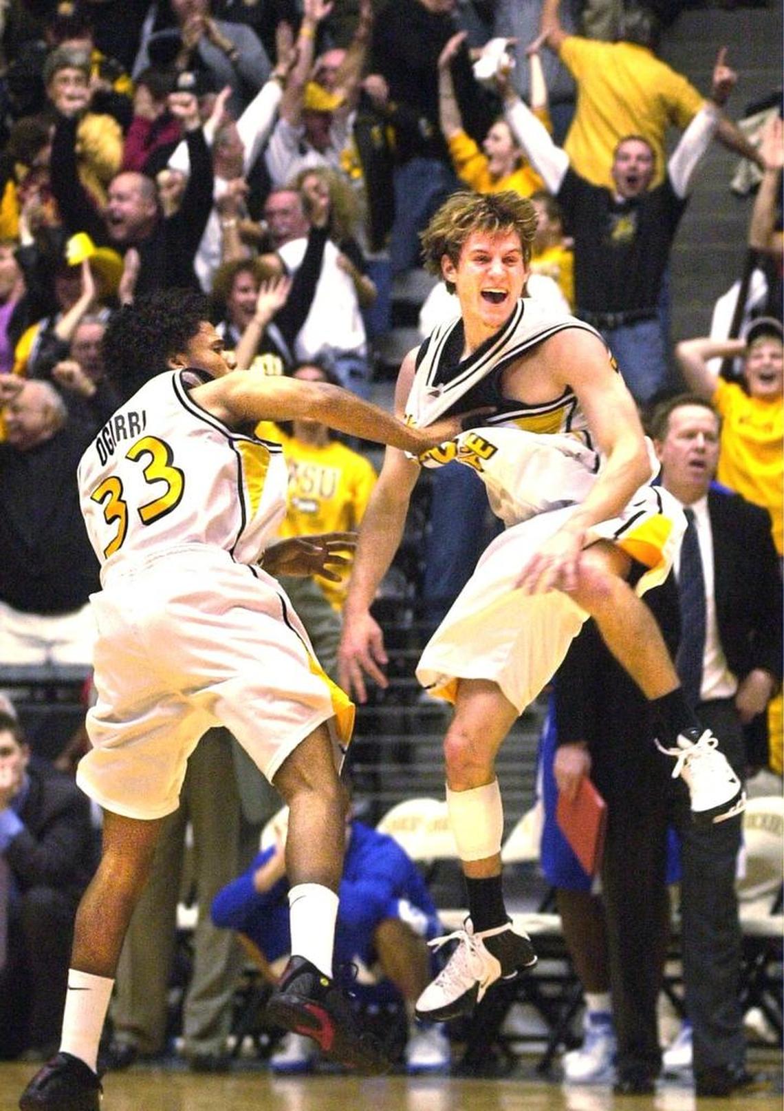 WSU’s Matt Braeuer, right, and teammate Sean Ogirri celebrate after Braeuer hit a three-pointer with half a second left to beat Creighton 62-61 on February 14, 2006.