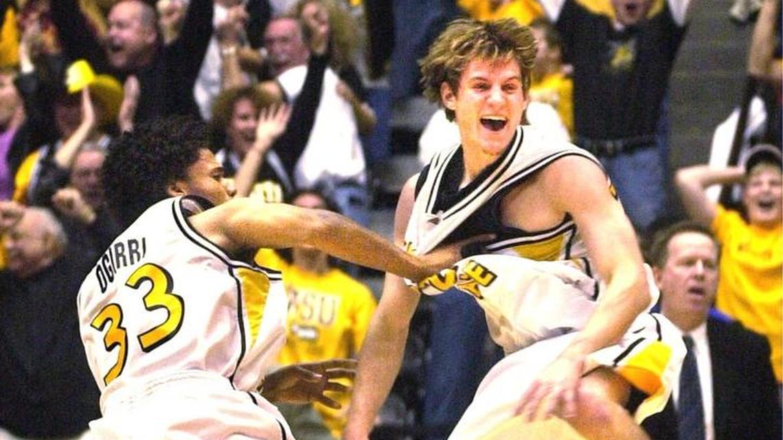 WSU's Matt Braeuer, right, and teammate Sean Ogirri celebrate after Braeuer hit a three-pointer with half a second left to beat Creighton 62-61 on February 14, 2006.