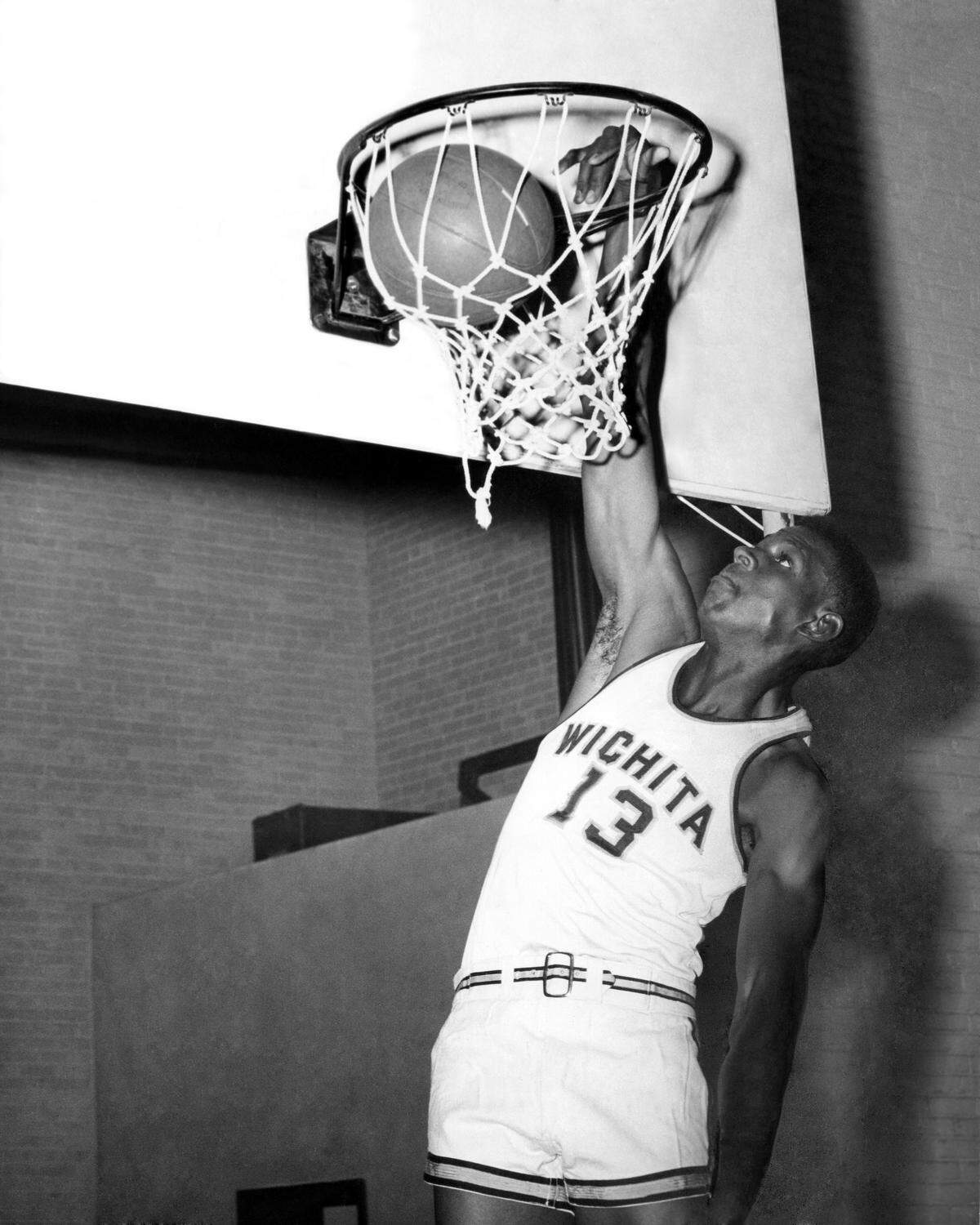 Wichita State legend Cleo Littleton dunks in an archive photo from his playing days at the University of Wichita. Littleton’s athleticism and scoring touch helped him become WSU’s career scoring leader with 2,164 points, a record that still stands to this day.