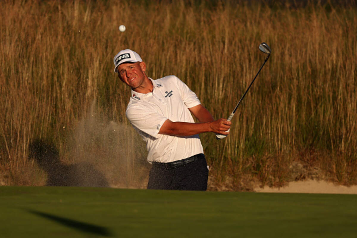 Wichita golfer Sam Stevens plays a shot from a bunker on the 17th hole during the third round of the 126th U.S. Open at Shinnecock Hills Golf Club on Saturday.