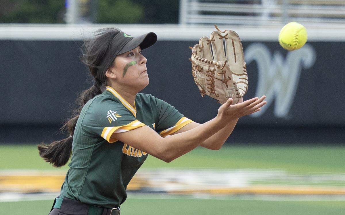 Bishop Carroll freshman Sydney Domebo catches a fly ball during the Class 5A state softball tournament at Wilkins Stadium, where the Golden Eagles capped a 28-3 season with a state championship.