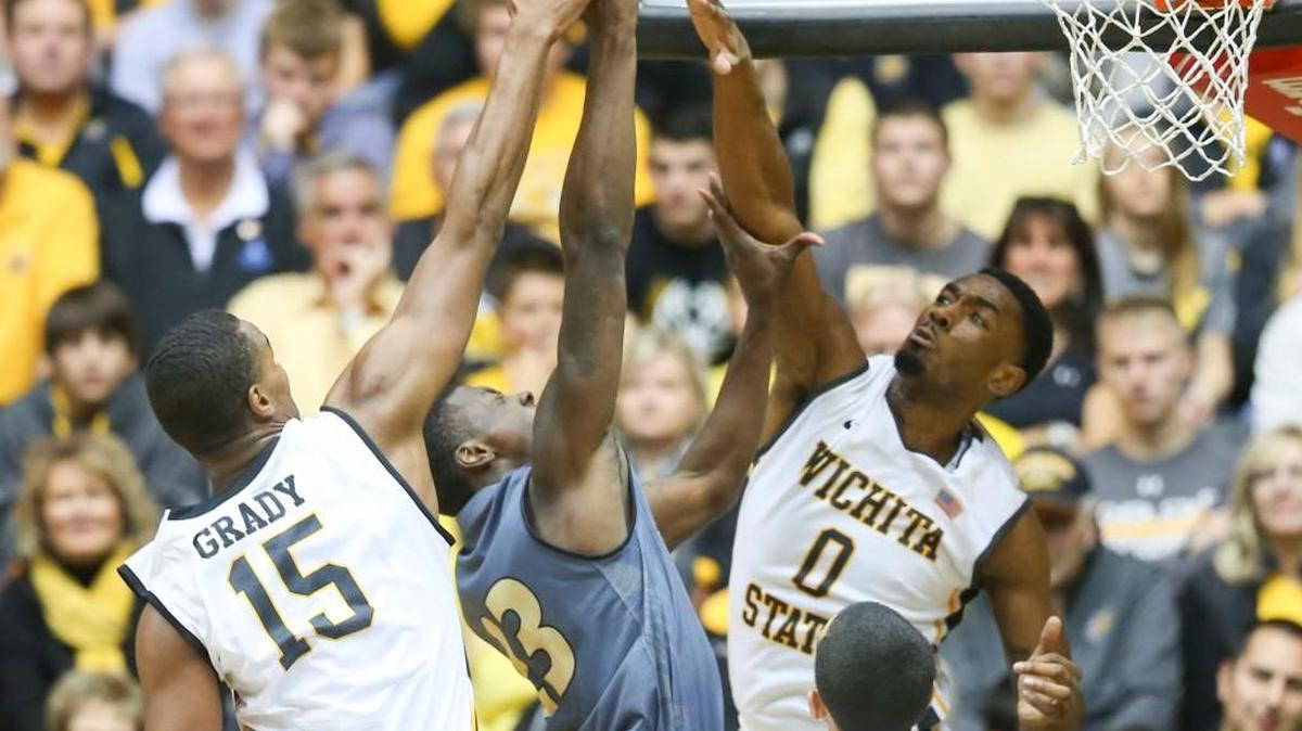 Wichita State forward Anton Grady and Rashard Kelly (0) play defense against Emporia State forward Terrence Sardin on Nov. 21 at Koch Arena.