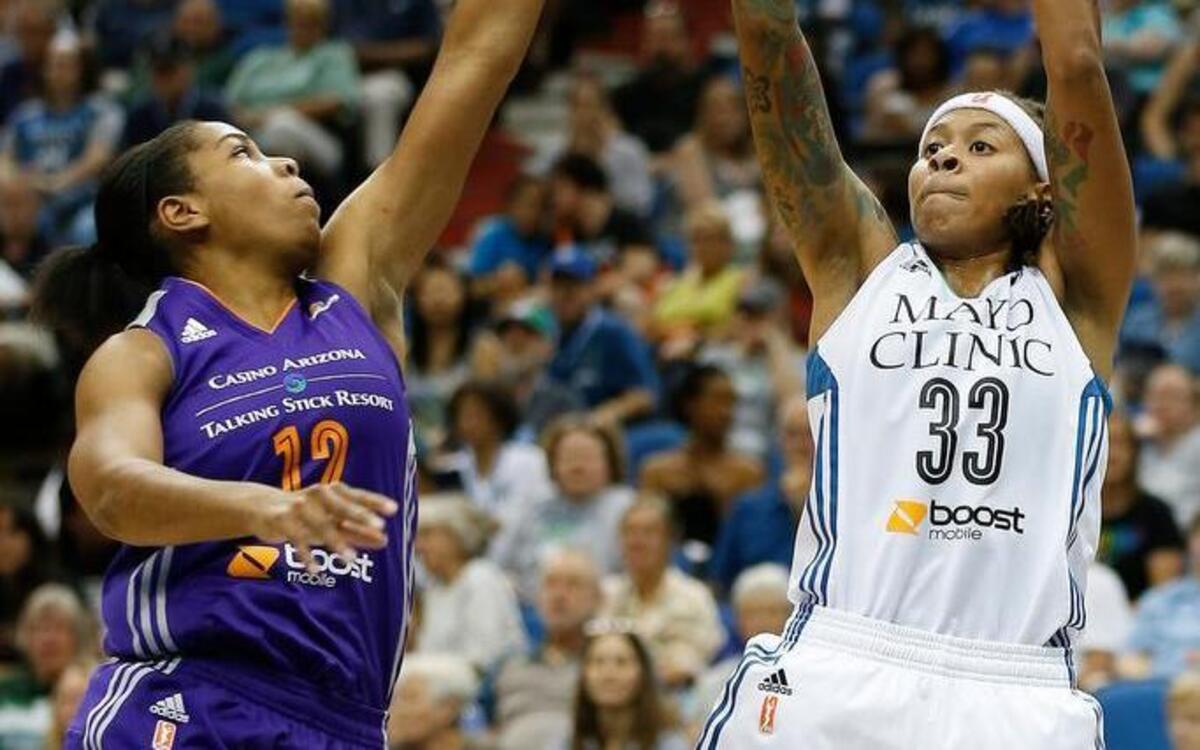 
Minnesota Lynx guard Seimone Augustus (33) shoots against Phoenix Mercury guard Alex Harden (12) during the first half of a WNBA basketball game on June 27 in Minneapolis.
