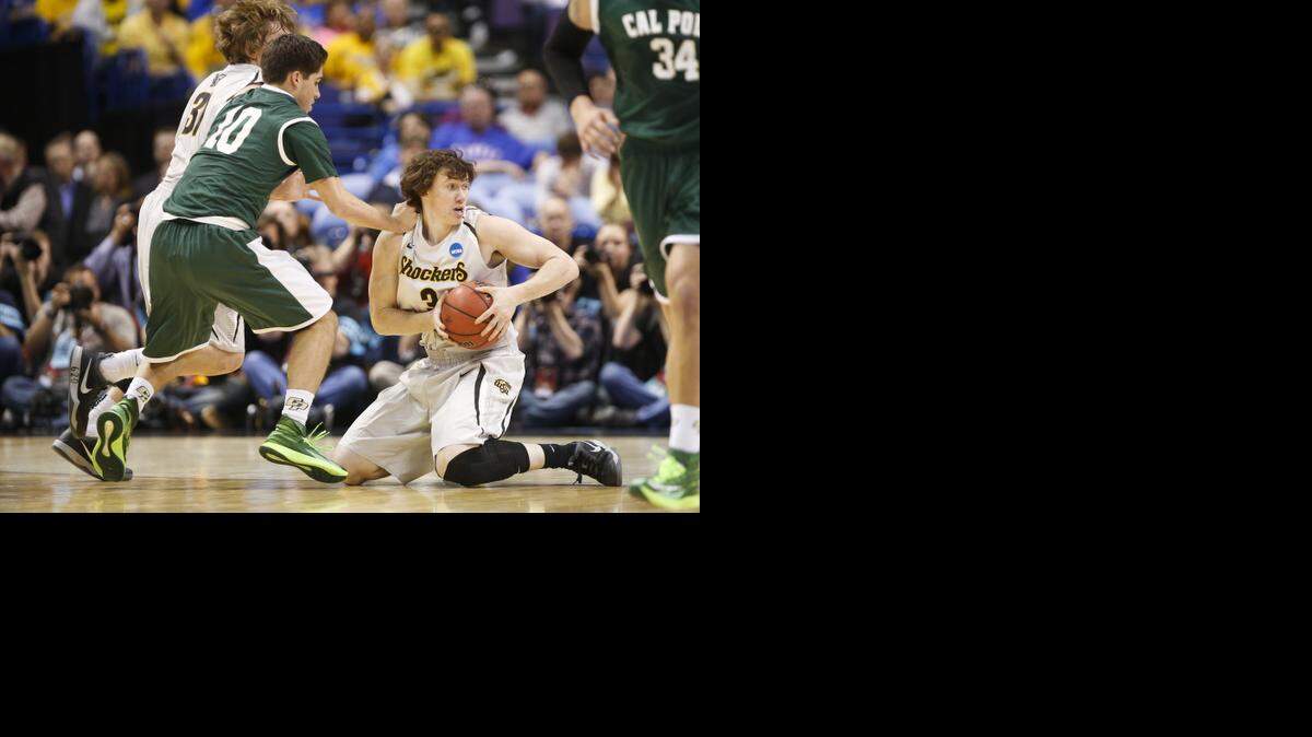 
Wichita State's Evan Wessel grabs a loose ball against Cal Poly in the second round of the NCAA tournament in St. Louis last March.
