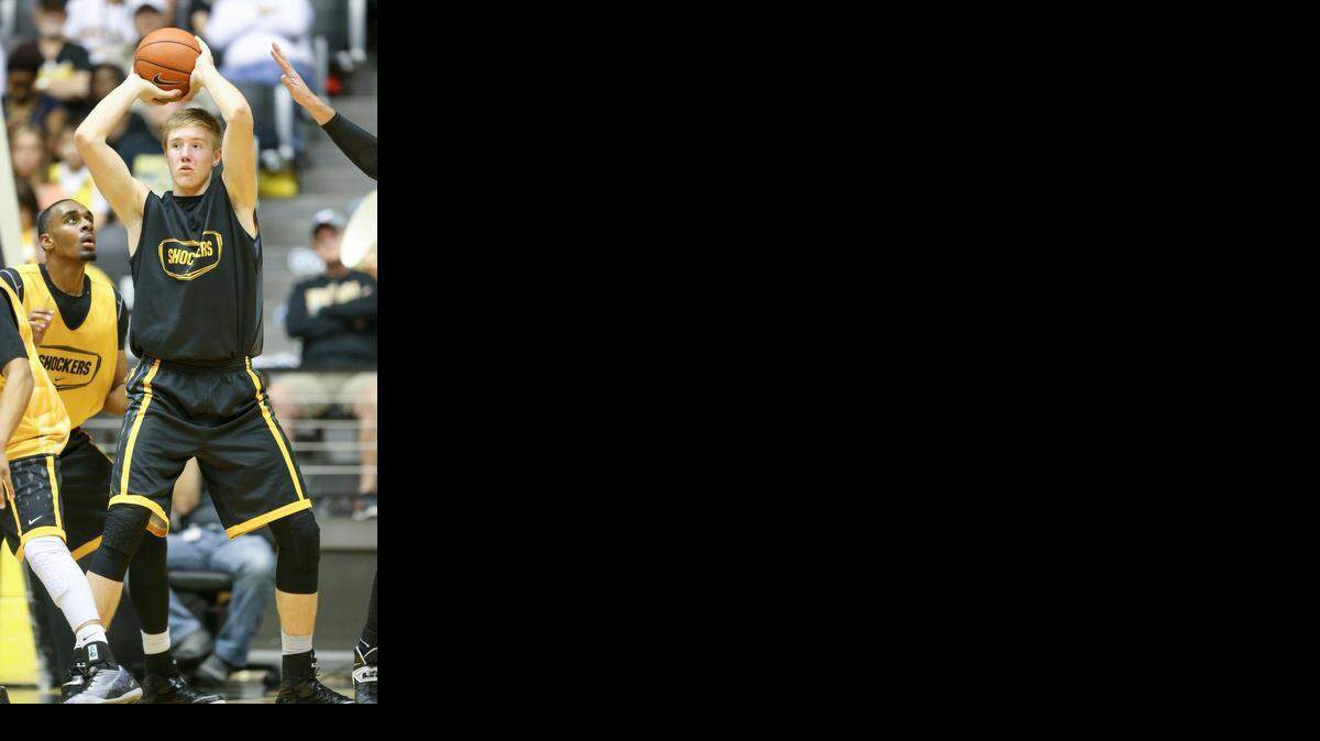 
Rauno Nurger look to pass the ball during the scrimmage at Shocker Madness on Thursday at Koch Arena.
