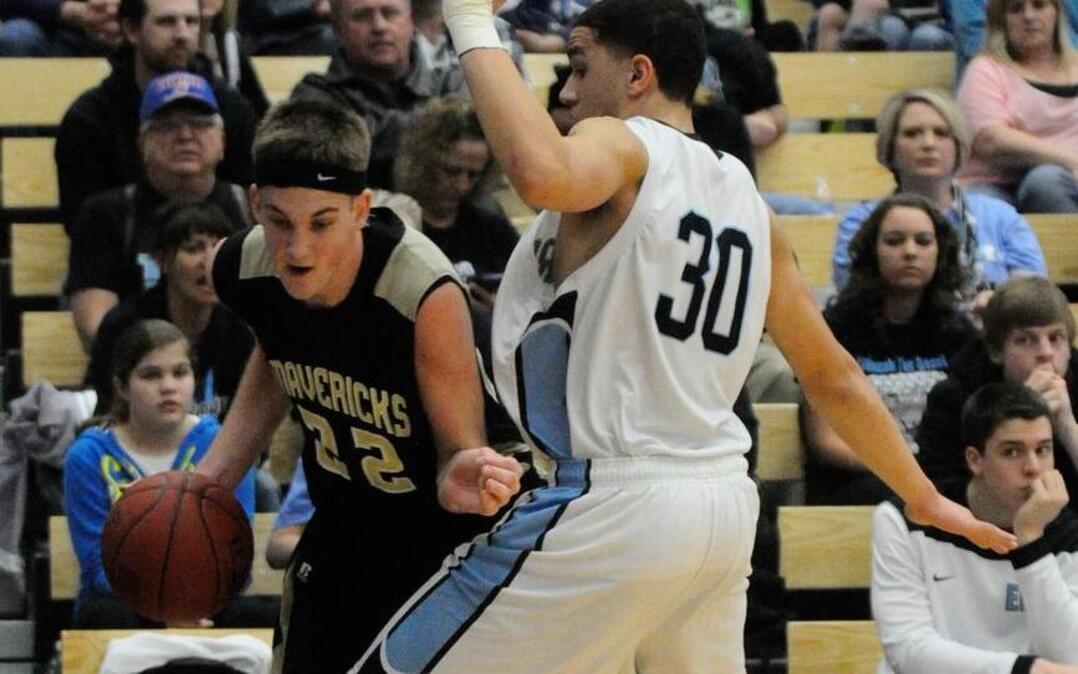 
Brett Barney (22) of Maize South drives around Tyler Buchanan (30) of Eisenhower in a 2014 sub-state final.

