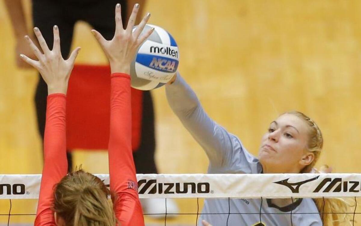 
Katy Dudzinski hits a kill shot against Illinois State's Eliza Smith duirng a match last season at Koch Arena. 

