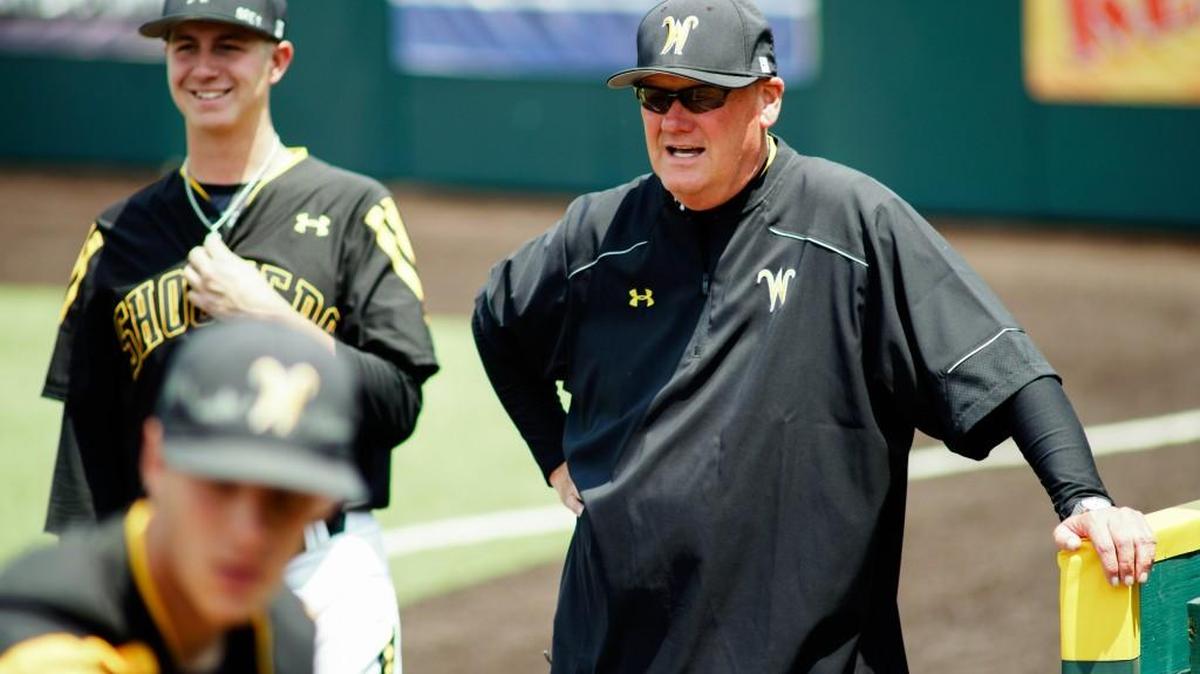 Assistant Coach Brent Kemnitz shouts instructions to pitchers warming up in the bullpen on May 21 at Eck Stadium.