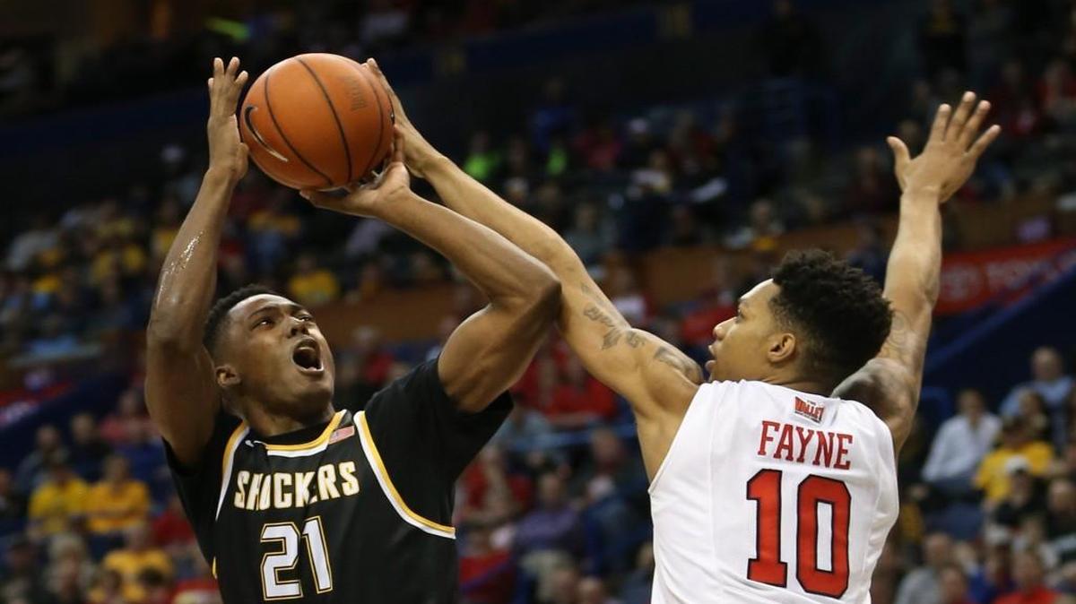 Darral Willis shoots – left-handed – over Illinois State forward Phil Fayne during the Missouri Valley Conference Tournament championship game in March.