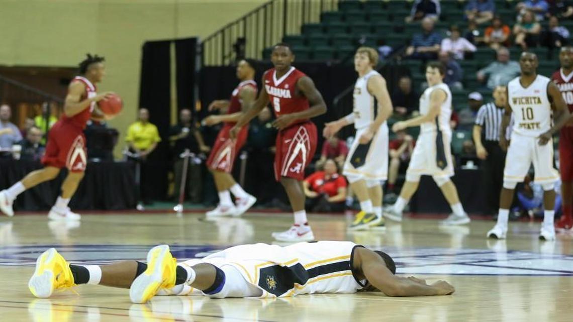 Wichita State forward Anton Grady lies motionless on the court after a collision with an Alabama player during the second half of Friday’s game at the AdvoCare Invitational in Orlando, Fla.