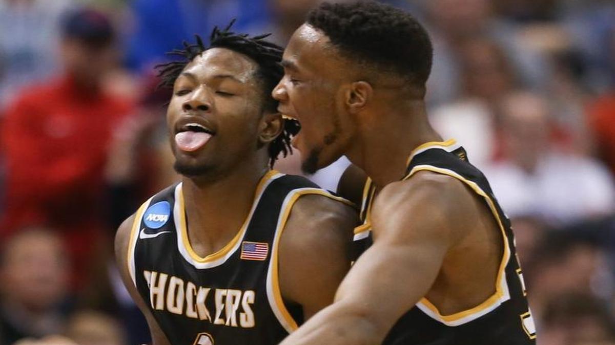 Wichita State forward Zach Brown, left, and Markis McDuffie celebrate after Brown hit a three-pointer against Dayton during the NCAA Tournament.