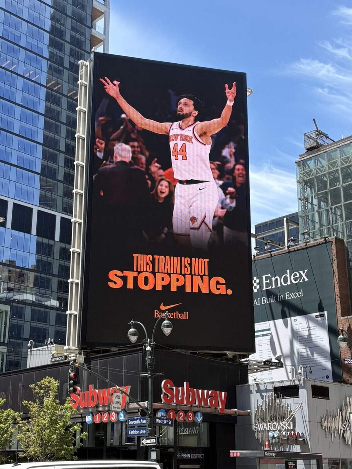 A large advertisement featuring Landry Shamet is displayed on the side of a building in New York City during the Knicks’ run to the NBA Finals.