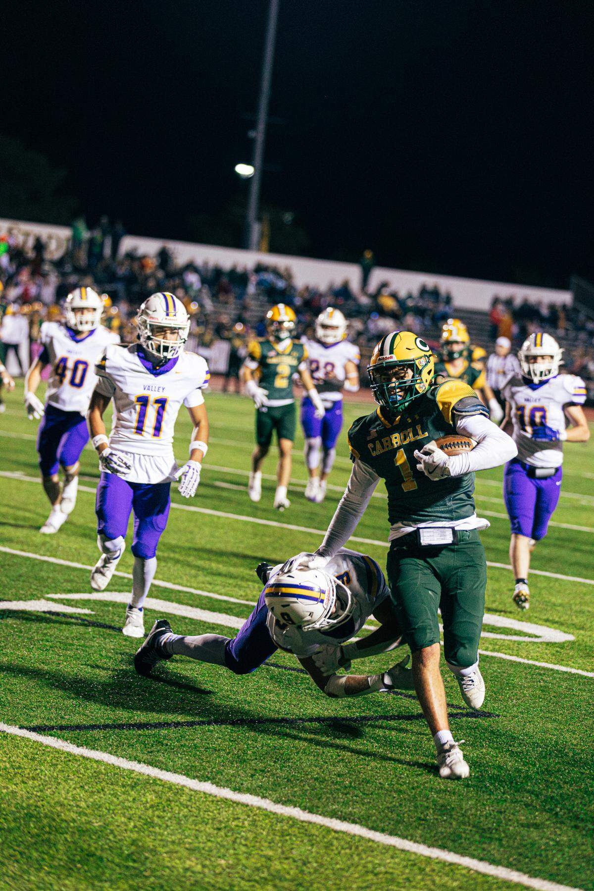 Bishop Carroll senior Landon Steven looks to evade a tackler in last week’s win over Valley Center. The Golden Eagles will take on No. 1 Great Bend on Friday in the Class 5A playoffs.