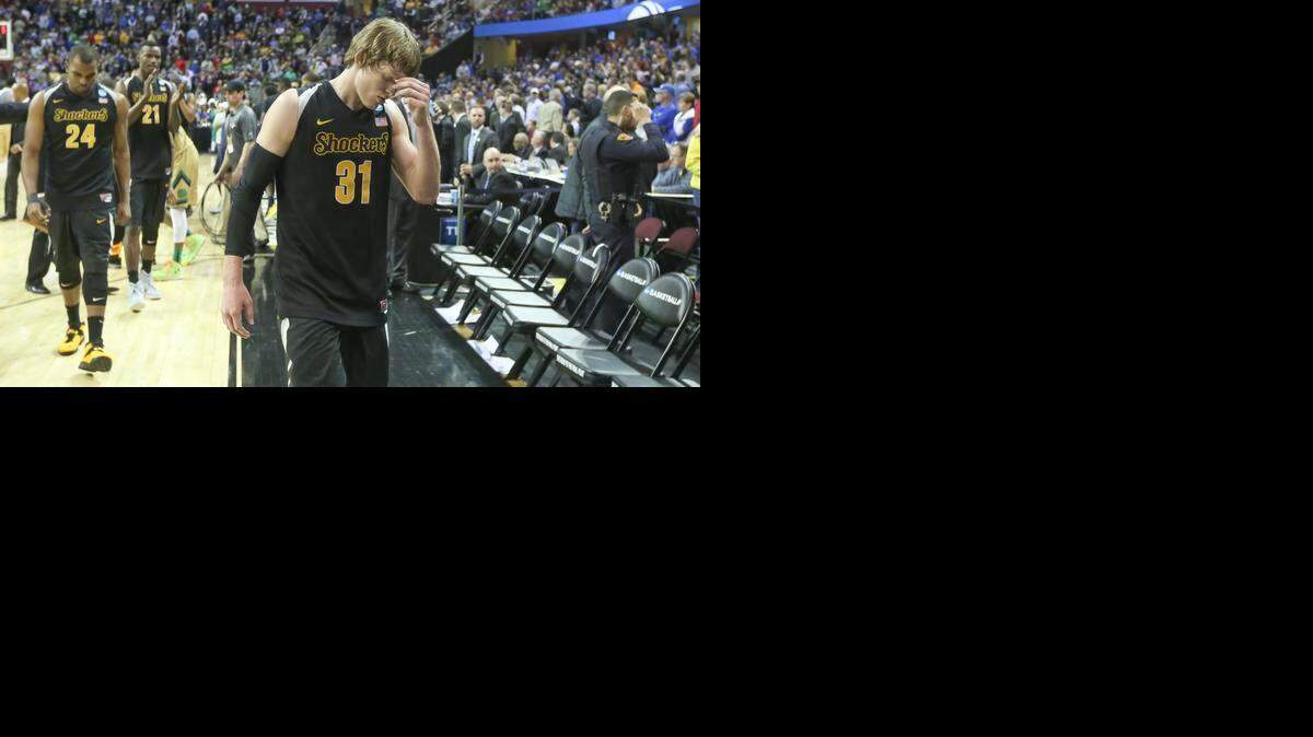 
Wichita State guard Ron Baker walks off the court after the Shockers were defeated by Notre Dame 81-70 in the Midwest Regional semifinal at Quicken Loans Arena in Cleveland on Thursday.
