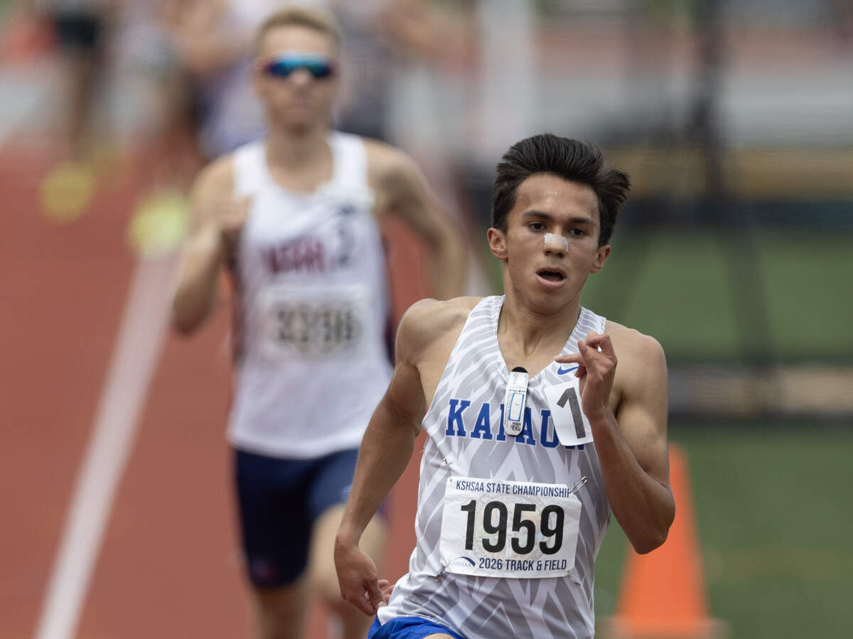 Kapaun Mt. Carmel senior Daniel Enriquez pulls away to win the Class 5A boys 1600-meter state championship for the second straight year at the Kansas high school state track and field meet in Wichita.