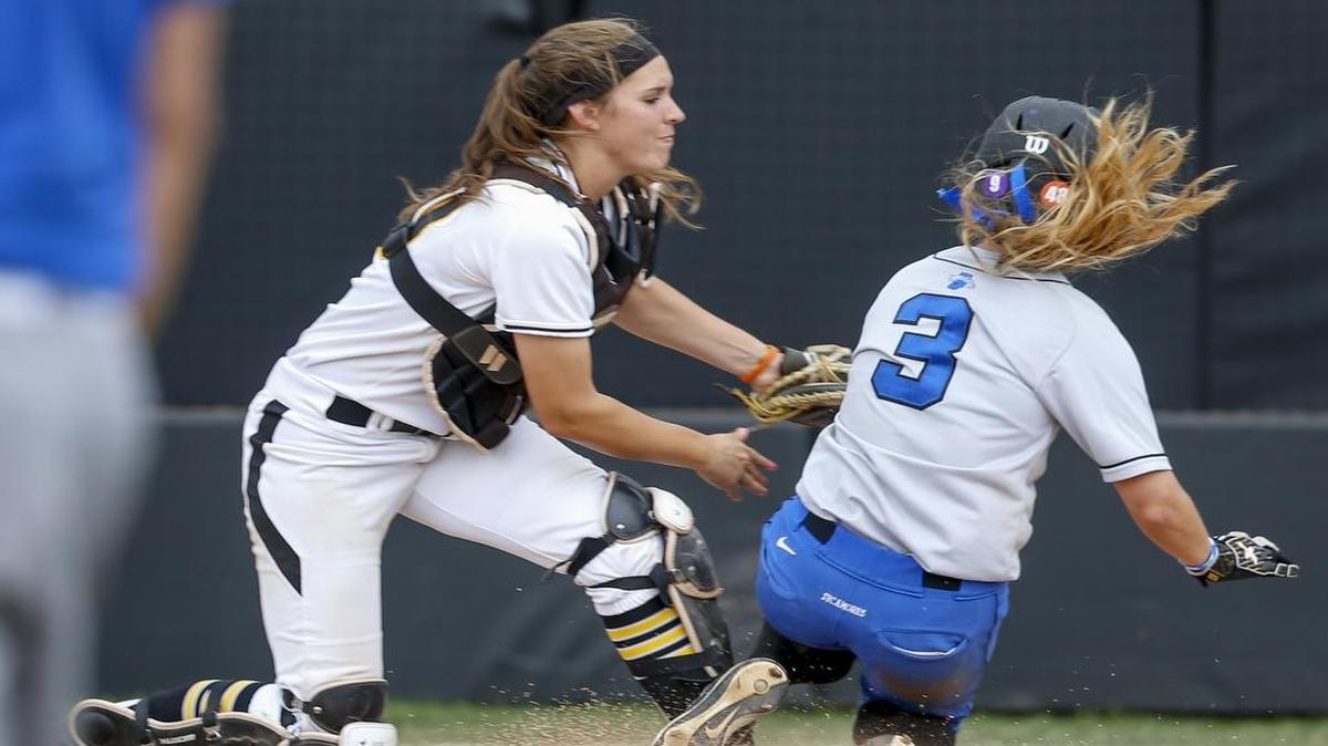 
Wichita State catcher Melanie Jaegers tags out Indiana State's Rylee Holland in the fourth inning Thursday during the MVC Tournament at Wilkens Stadium.
