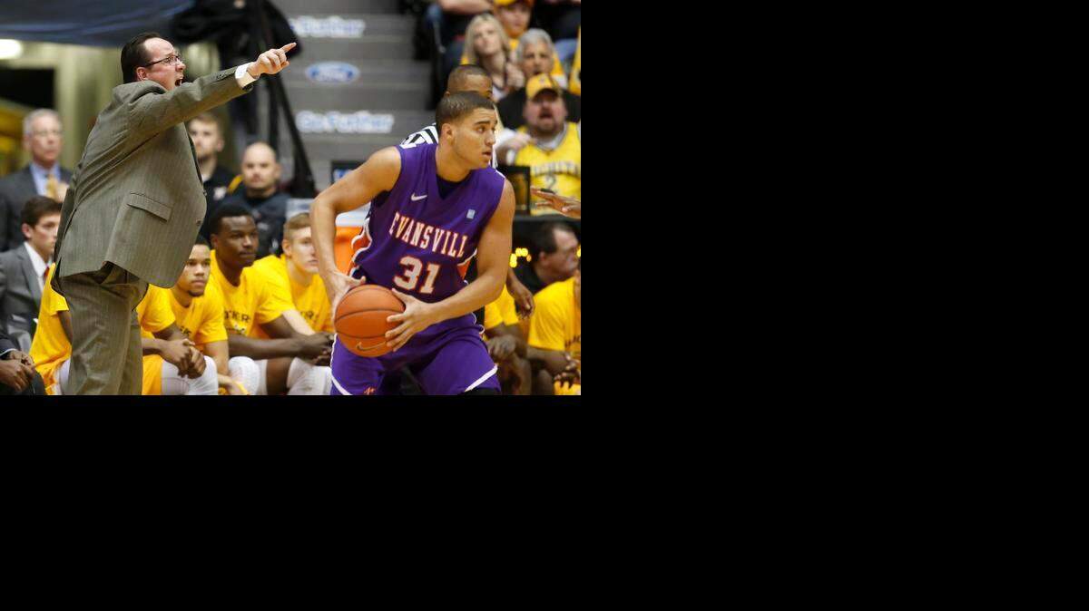 
Wichita State coach Gregg Marshall gives direction to his team. At right is Evansville's D.J. Balentine. 
