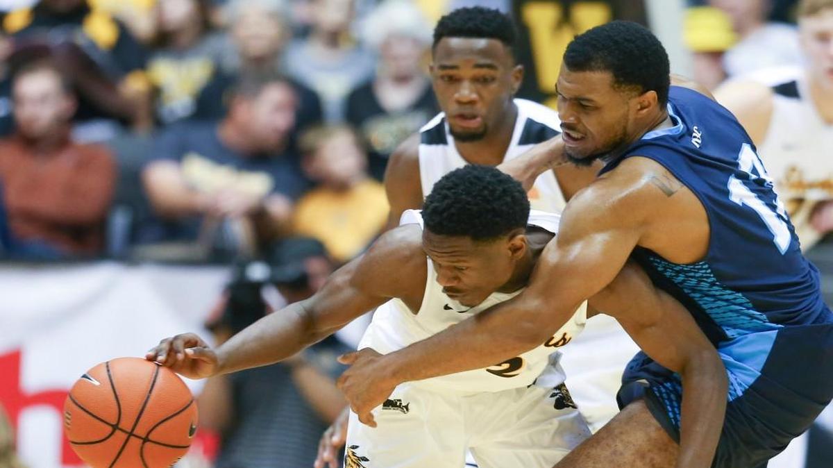 Wichita State’s Daishon Smith steals the ball away from Augusta’s Tyvez Monroe during the Shockers’ exhibition game. Smith’s defensive lapses were of greater interest to coaches during a film session.
