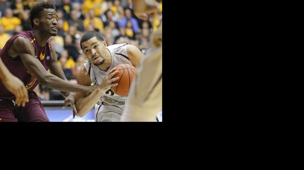 
Wichita State guard Fred VanVleet tries to go to the basket against Loyola guard Devon Turk during the first half on Wednesday night at Koch Arena. (Jan. 28, 2015)
