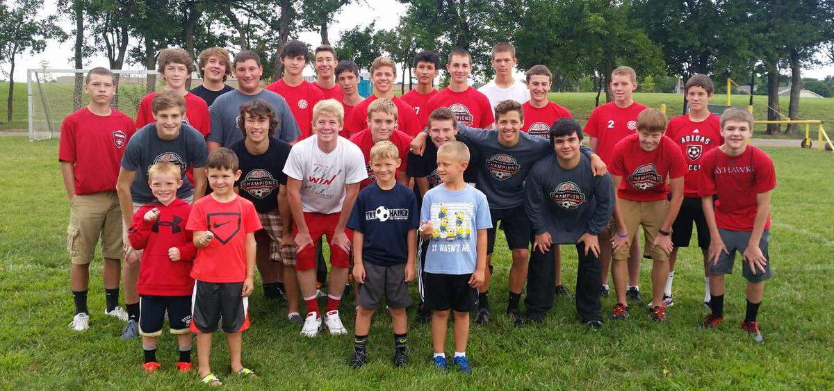 Current Rose Hill senior Jordy Kaba (middle front, navy shirt) is shown with future teammates Jax Kaba, Caedon Defoor and Landon Marshall when they were just kids celebrating with Rose Hill’s 2015 boys soccer team that won the Class 4-1A championship.