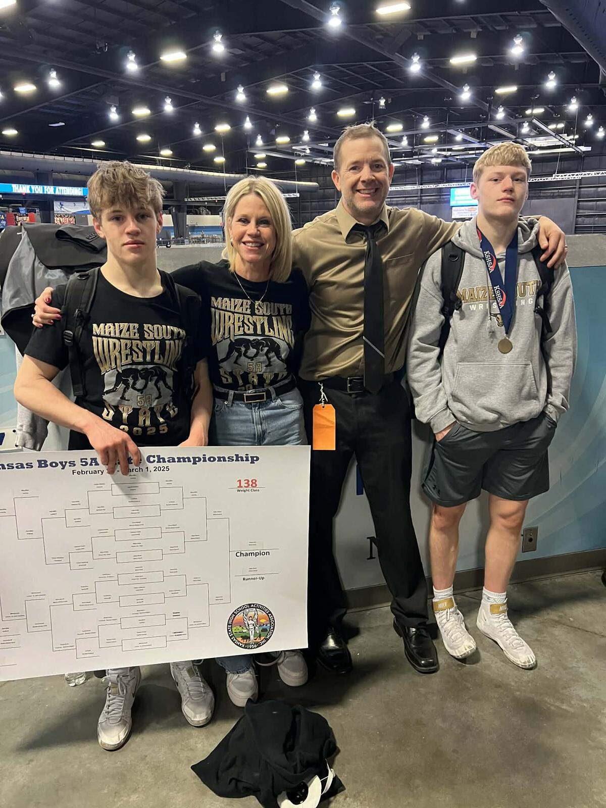 Wrestling has been a family affair for the Kerr family. Josh (left) and Max (right) are currently ranked No. 1 in their respective weight classes in Class 5A, while they are both coached by their father, Matt (middle), on the Maize South boys wrestling team.