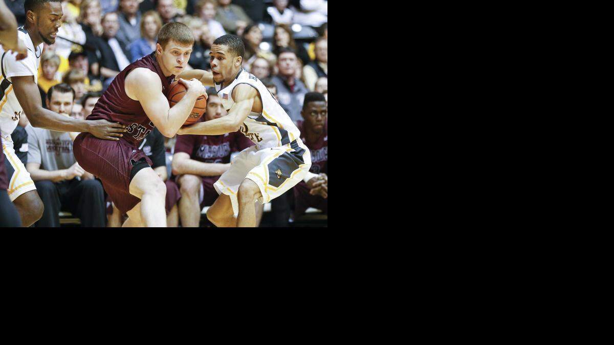
Wichita State's Ria'n Holland , right, and Tevin Glass, left, pressure Missouri State's Austin Ruder as they apply the full court press early in the first half at Koch Arena on Saturday. (Feb. 7, 2015) 
