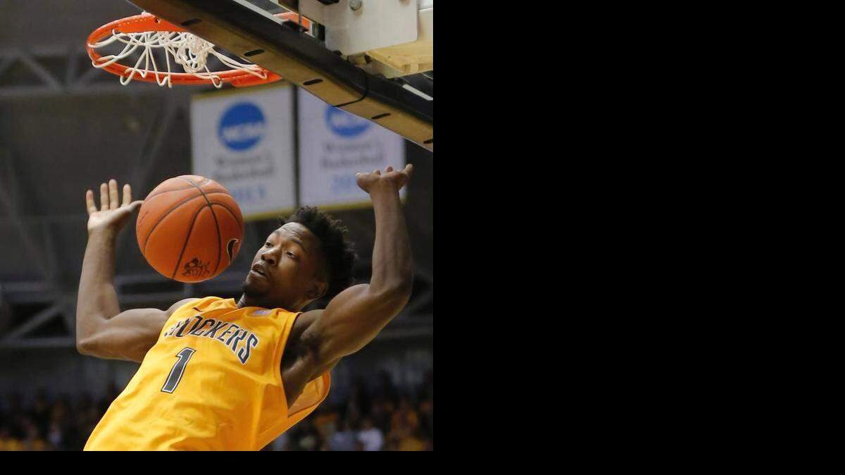 
Shocker freshman Zach Brown dunks during Sunday’s win over Newman
