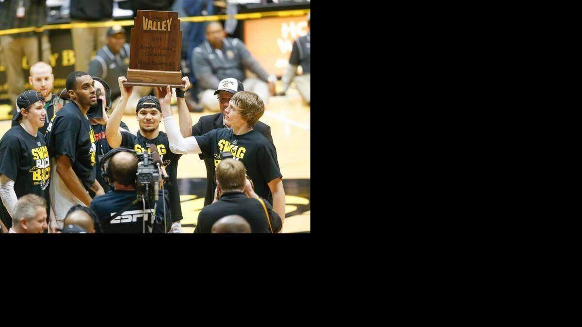 
Wichita State players hold the MVC championship trophy on Saturday after defeating Northern Iowa.
