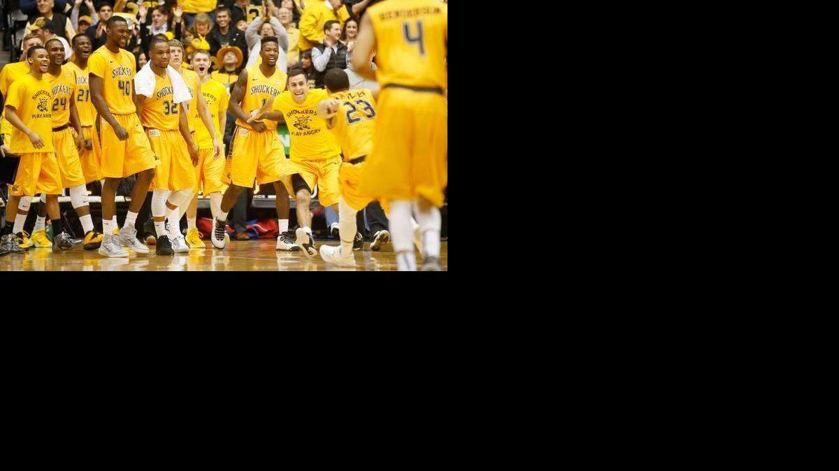 
Wichita State players celebrate after Fred VanVleet’s basket late in the first half on Sunday.
