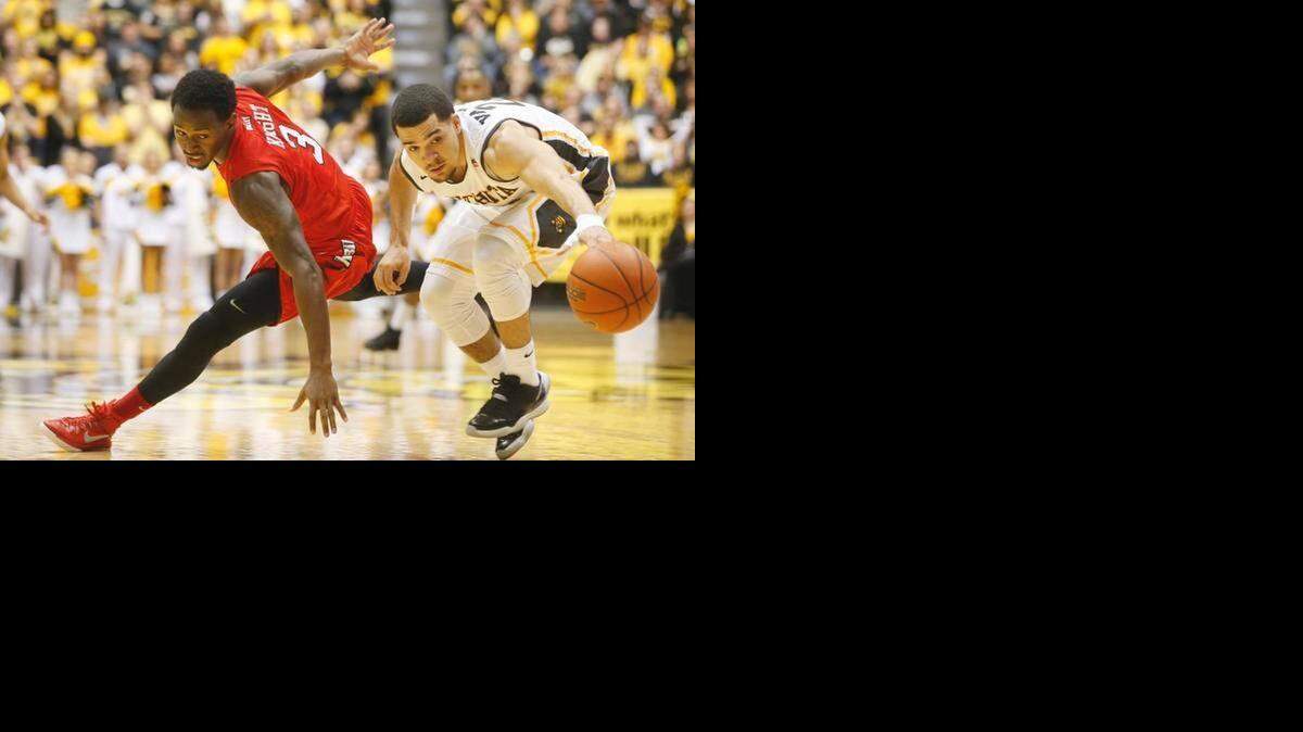 
Illinois State’s Daishon Knight (left) and Wichita State’s Fred VanVleet chase a loose ball during WSU’s 70-62 win at Koch Arena.
