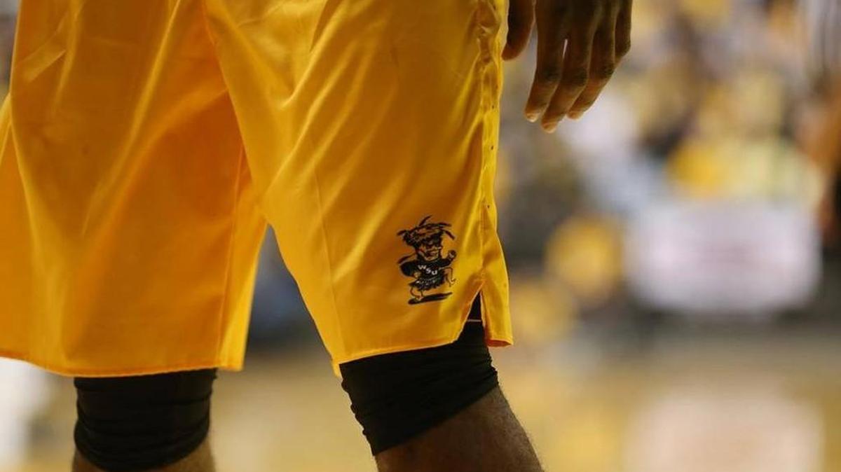 Wichita State’s yellow jerseys feature the old-school WuShock logo.
