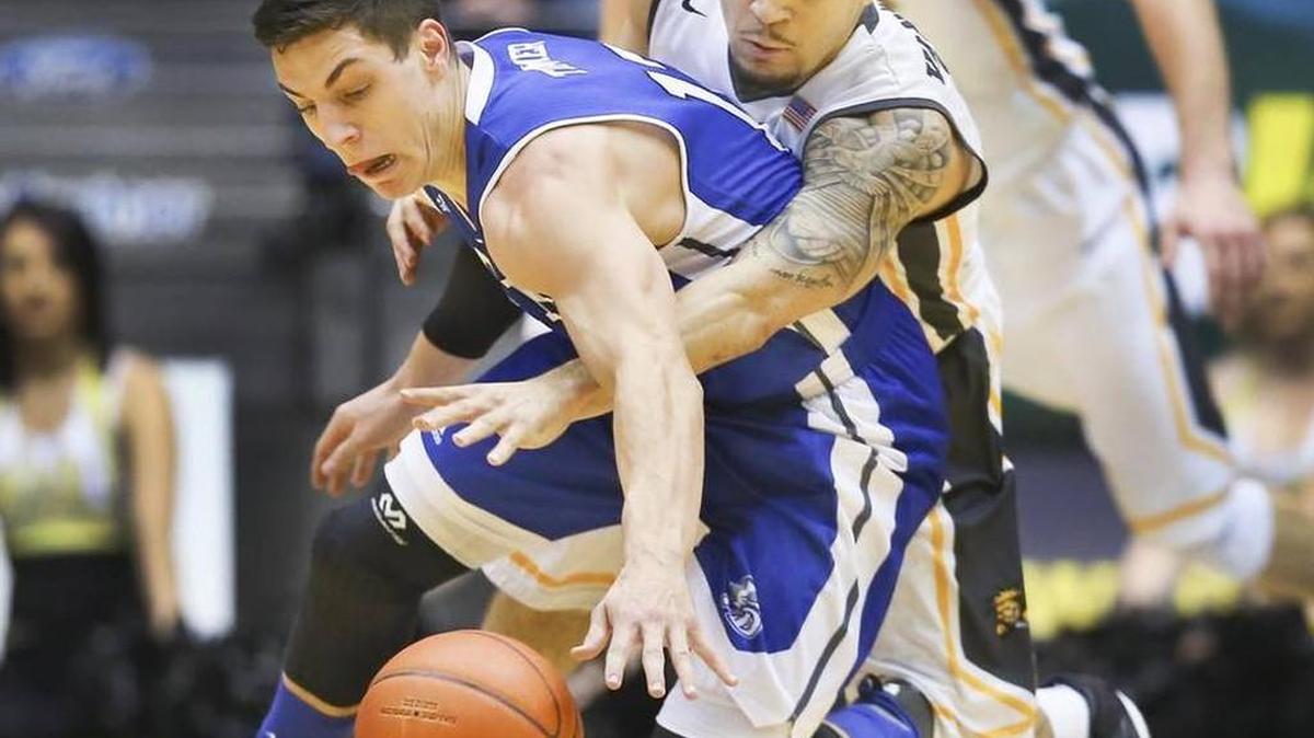 Wichita State guard Fred VanVleet defends Drake’s Reed Timmer during a Dec. 31 game at Koch Arena.