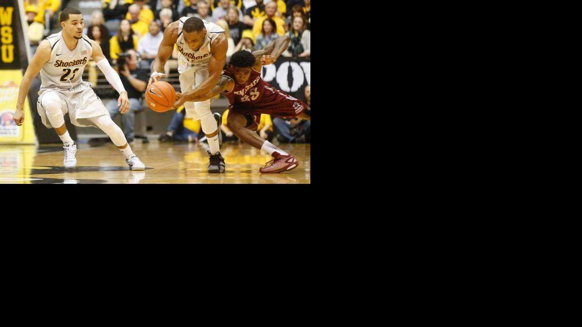 
WSU senior Tekele Cotton grabs one of his three steals during a win over New Mexico State on Friday at Koch Arena.
