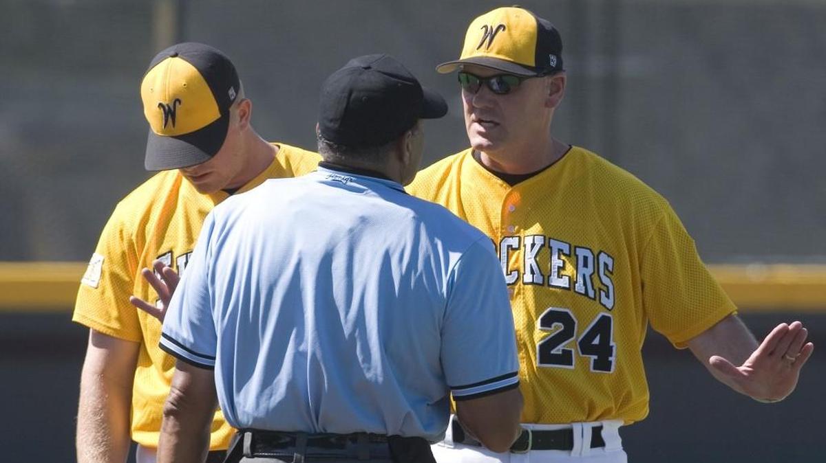 Pitching coach Brent Kemnitz has words with home plate umpire Rich Padilla during the ninth inning of a 2007 game at Eck Stadium.