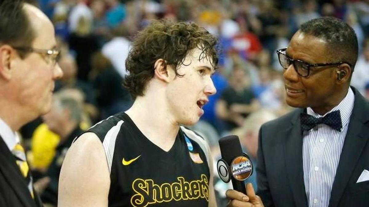 
Wichita State’s Evan Wessel talks with CBS’ Lewis Johnson, with coach Gregg Marshall watching, after March’s victory over Kansas in Omaha.
