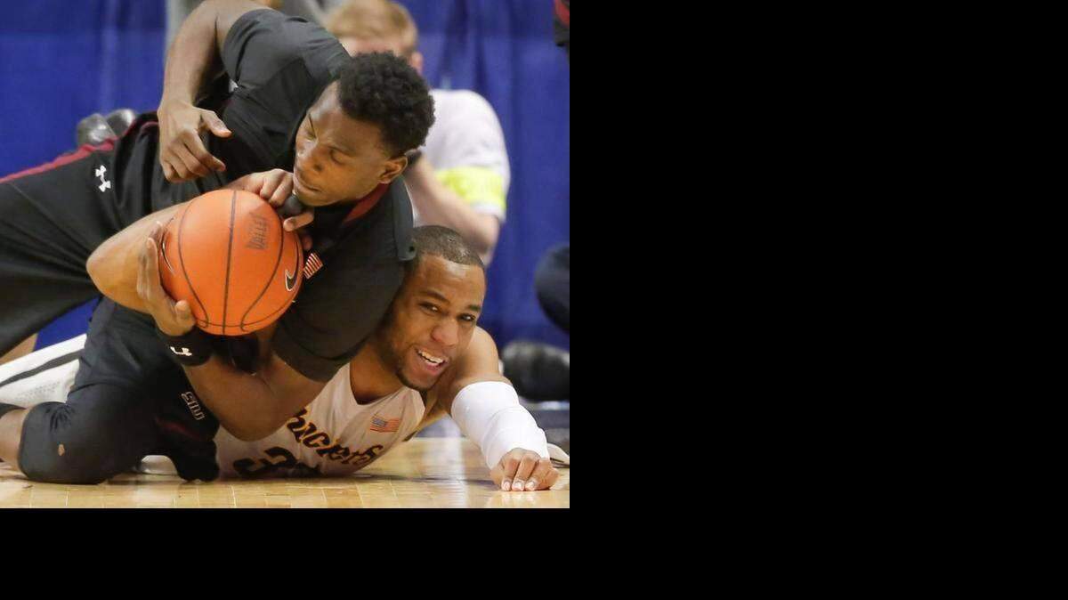 
It was a long, physically demanding regular season for Wichita State starters, such as Tekele Cotton (bottom).
