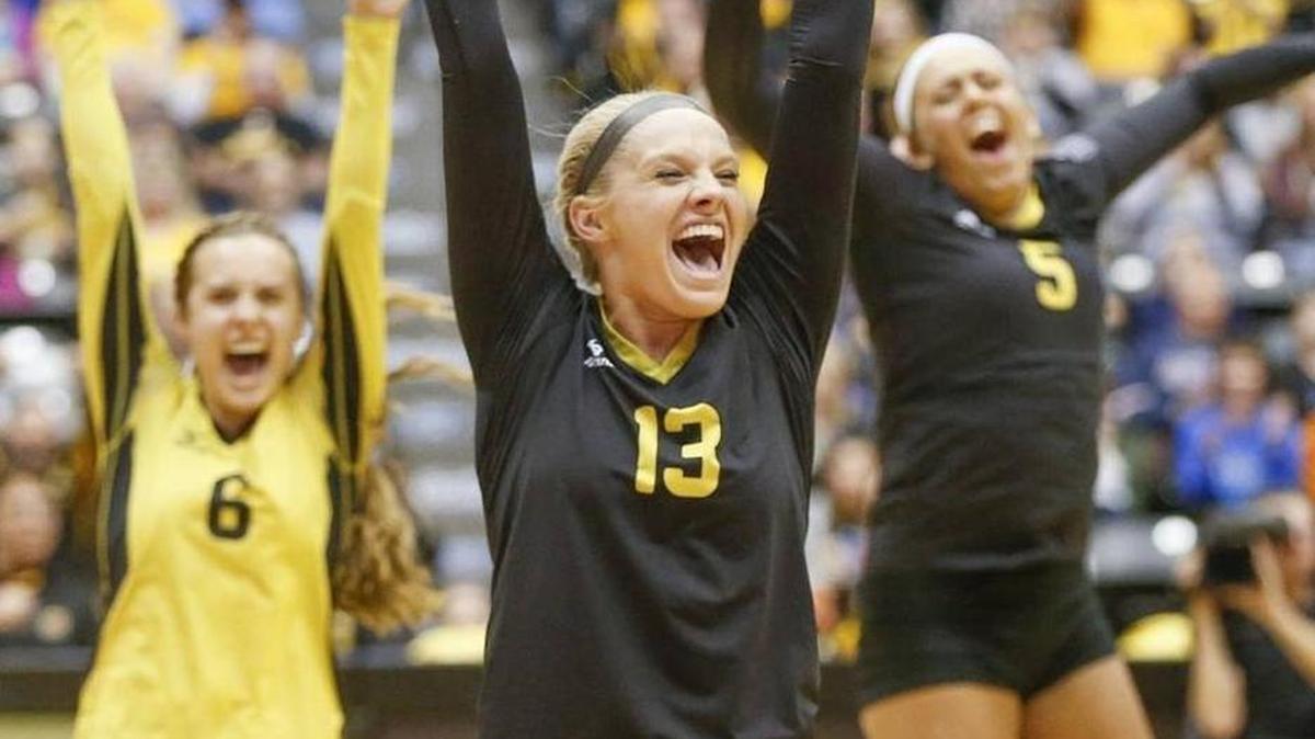Wichita State’s Emily Hiebert (13), Dani Mostrom (6) and MaryAshton Floyd celebrate during Saturday’s sweep of Evansville.