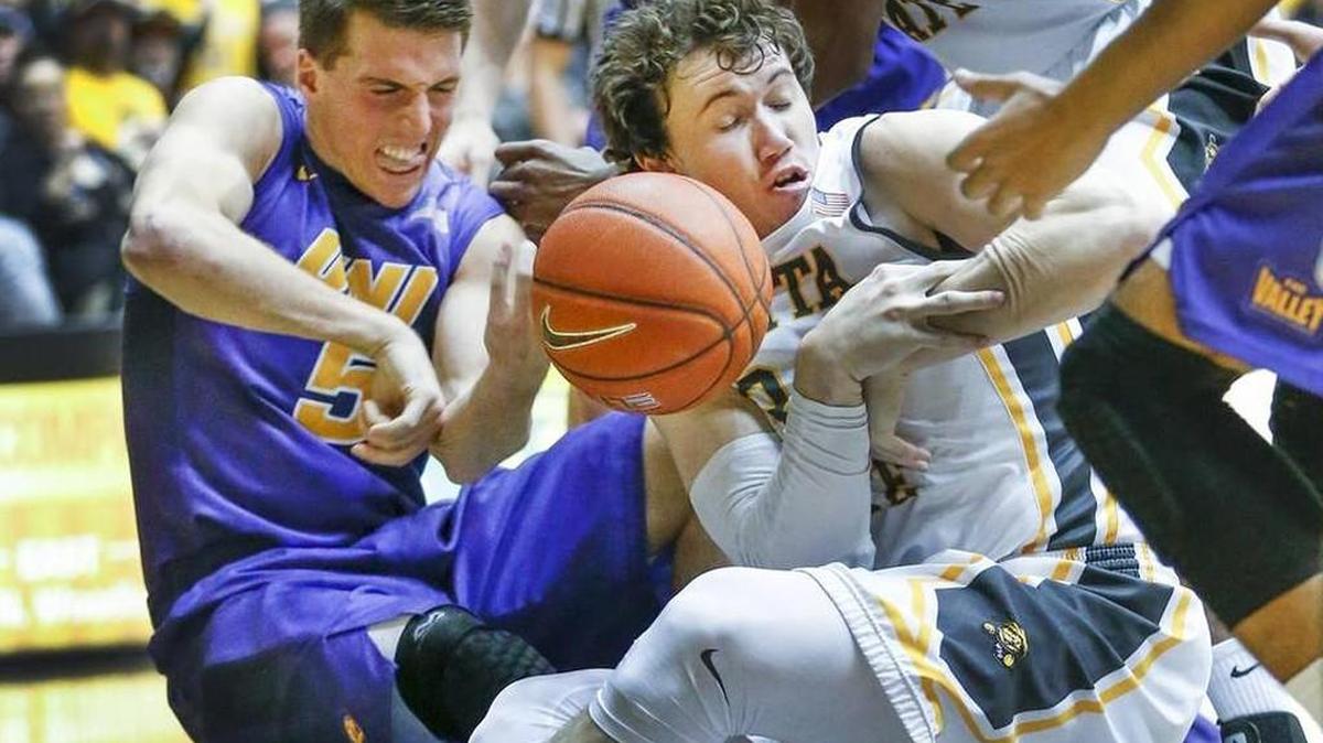 Wichita State's Evan Wessel, center, and Northern Iowa's Matt Bohannon, left, battle for a loose ball during the second half at Koch Arena Saturday.