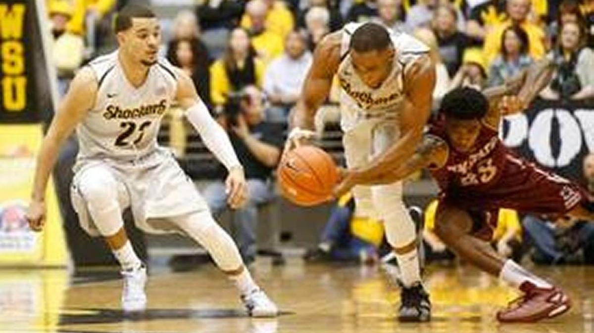 Former Wichita State player Tekele Cotton steals the ball during last season’s 71-54 win over New Mexico State at Koch Arena.