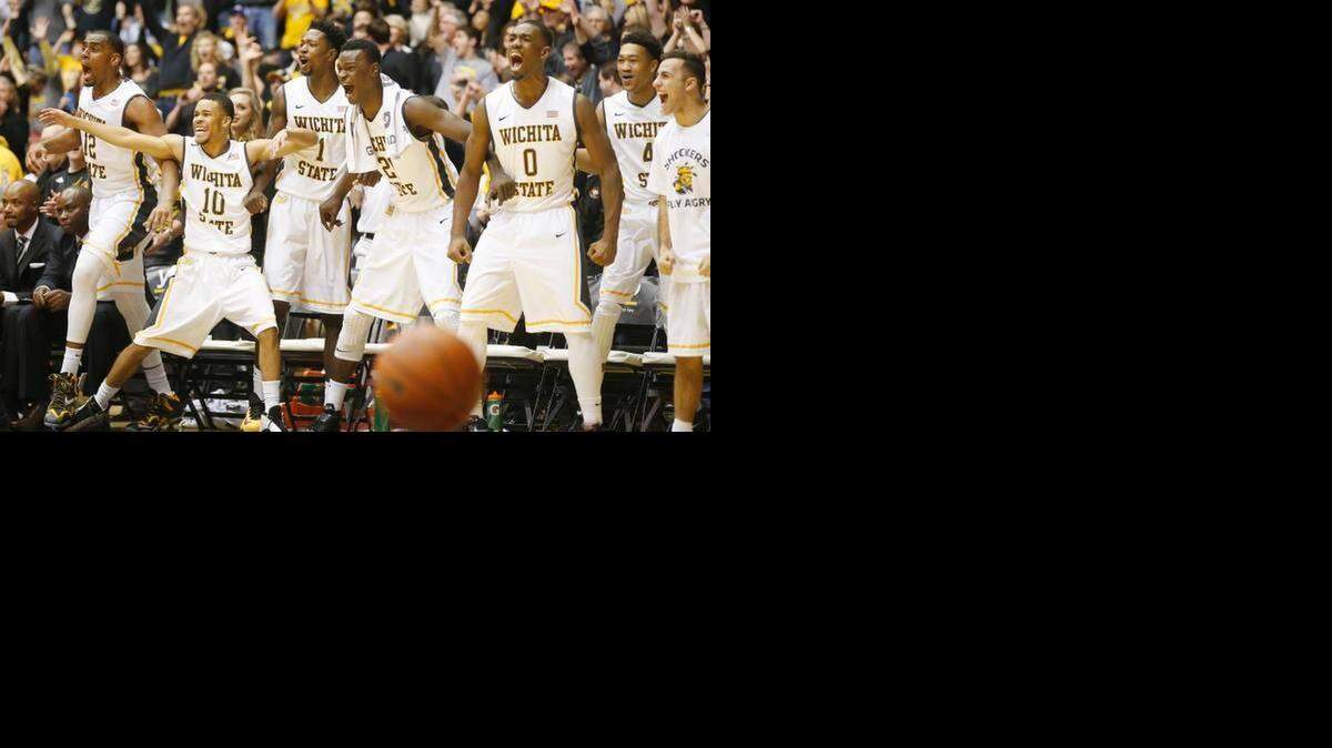 
Wichita State’s bench celebrates after Tekele Cotton’s dunk in the second half against Illinois State.
