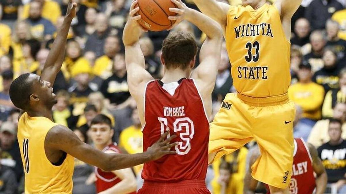 Wichita State's Connor Frankamp (33) and Ty Taylor pressure Bradley's Luuk van Bree during the first half at Koch Arena on Saturday