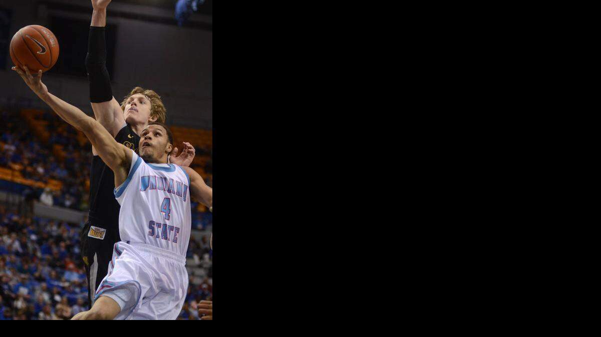 
Wichita State’s Ron Baker blocks a shot by Indiana State’s Brenton Scott.
