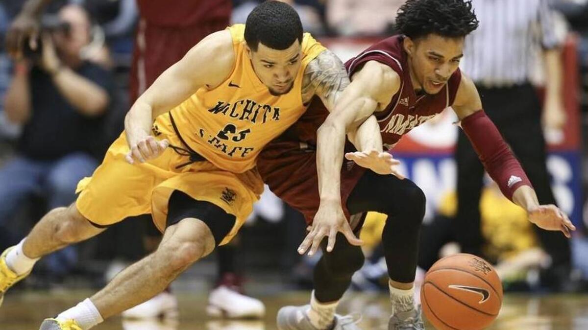 Wichita State’s Fred VanVleet beats New Mexico State’s Matt Taylor to a loose ball during the first half on Monday at Koch Arena.